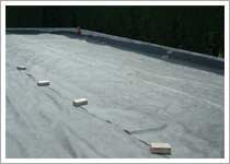 Lay a geotextile membrane to the total area of the driveway